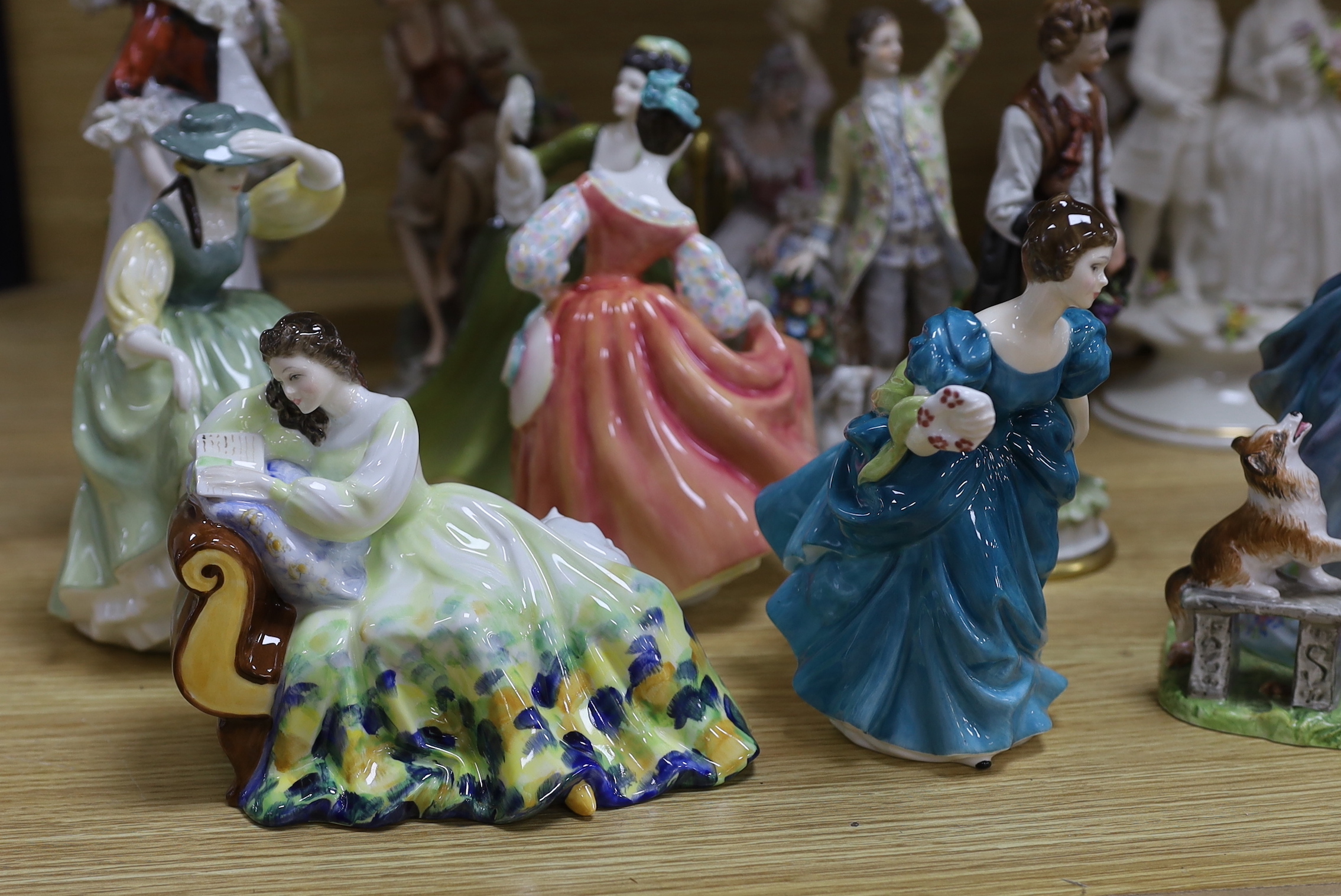 A collection of various porcelain figures including Coalport, Doulton etc. and two dessert plates